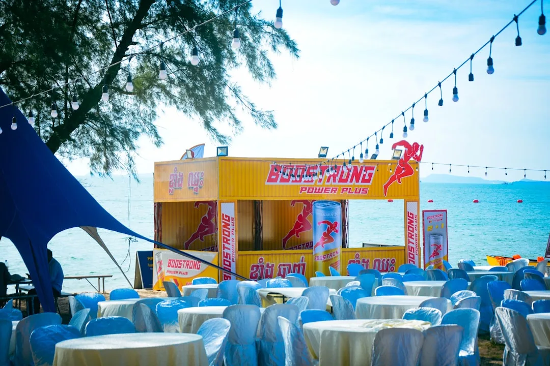Rooftop summer pop-up venue overlooking city skyline with pastel décor