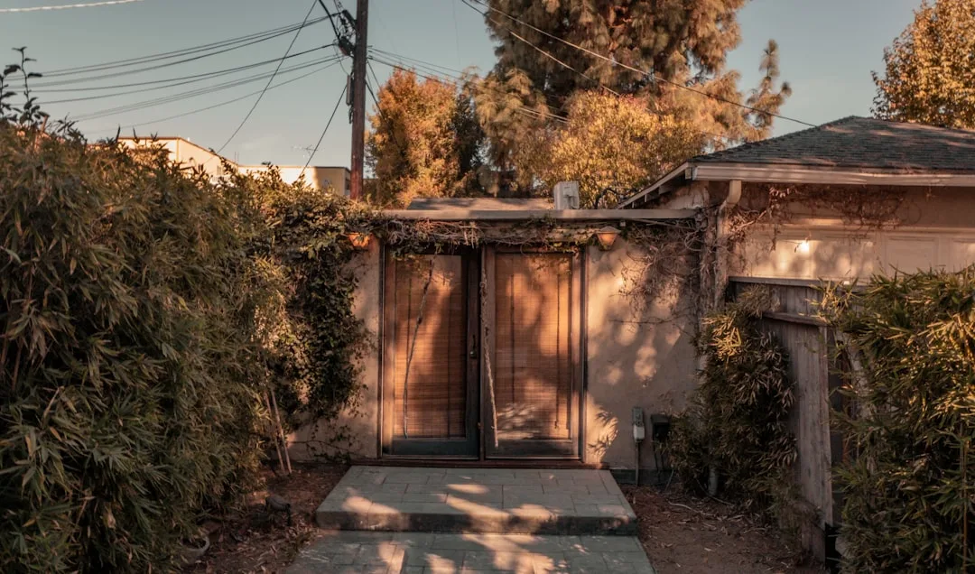 Converted garage accessory dwelling unit with separate entrance and landscaping