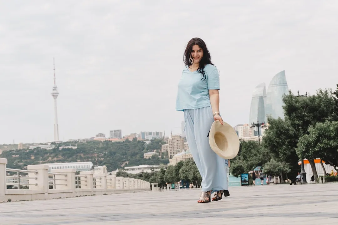Full-length styling of wide-leg trousers with pointed-toe leather shoes