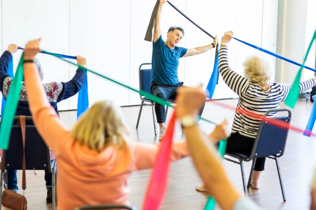 Older adult performing resistance band strength training after 50 with proper form