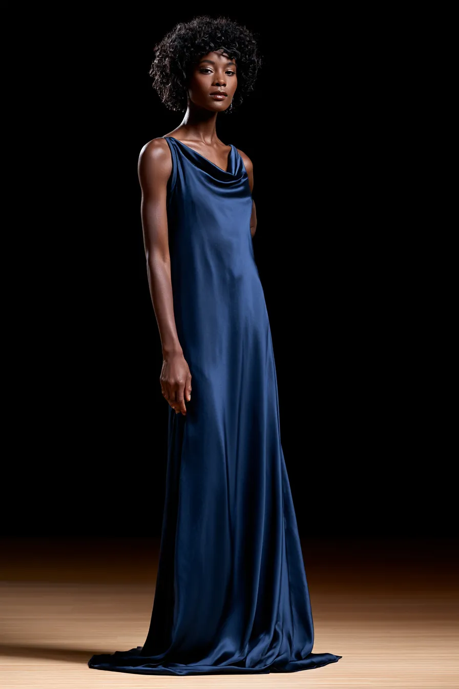 Classic floor-length gown for a black tie wedding guest in deep blue satin