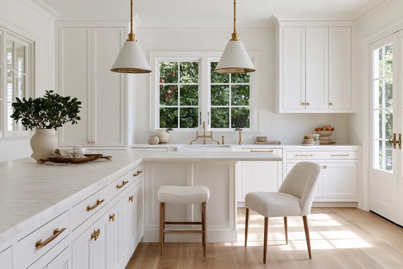 Kitchen design in white color palette with island seating and high gloss finishes