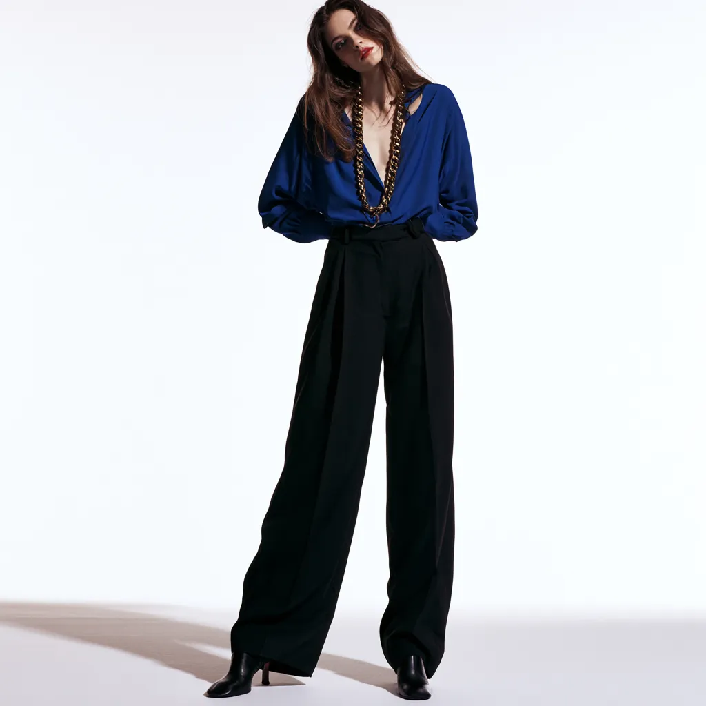 outfits for apple shaped figures deep scoop neck top high waist trousers gold chains editorial