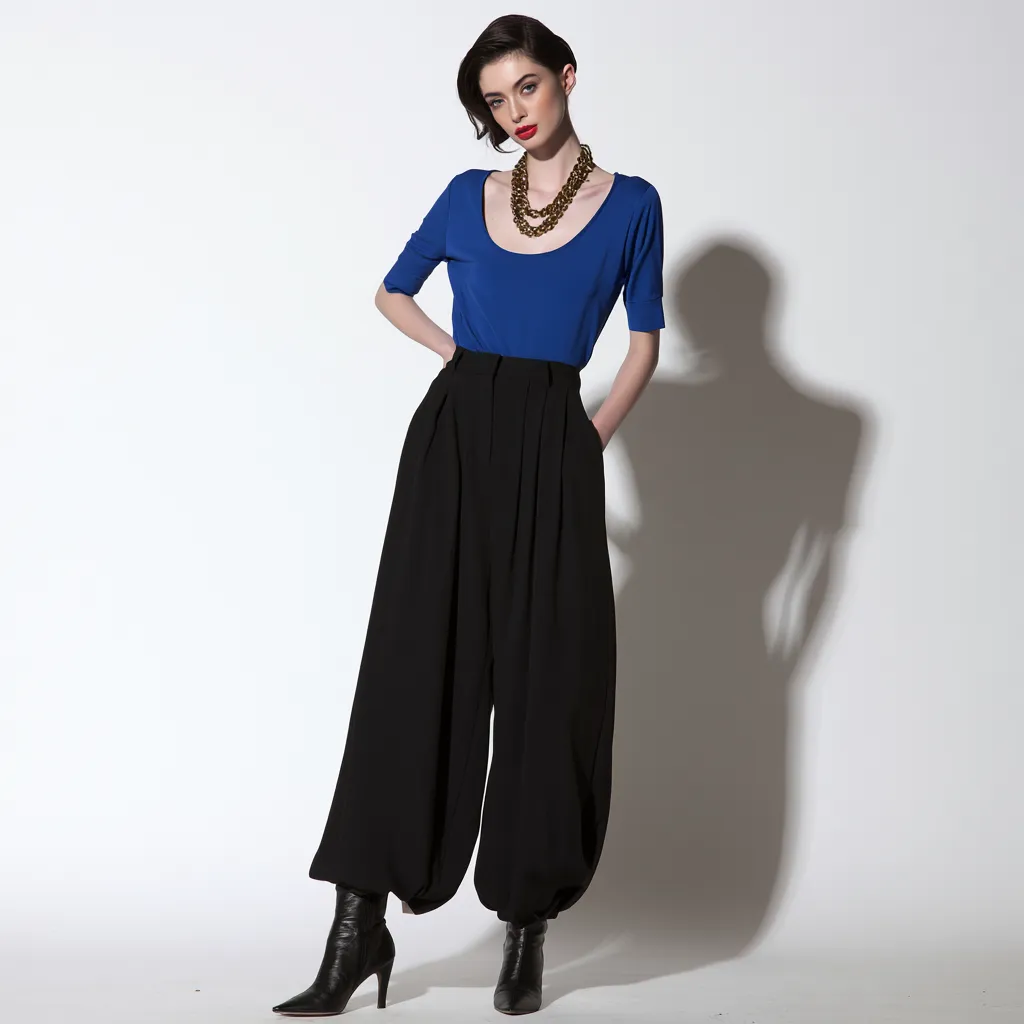 apple shape outfit idea blue fitted blouse tucked wide leg trousers pointed boots standing