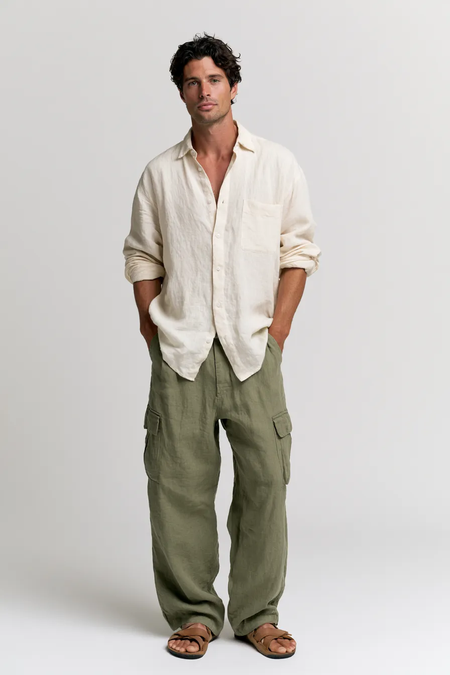 Stylish casual look for men featuring olive cargo pants and cream shirt, full standing pose on white background