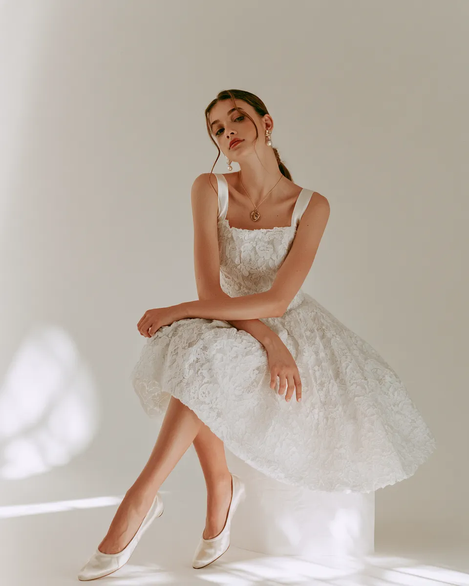 coquette lace dress outfit white lace midi A-line skirt pearl accessories standing