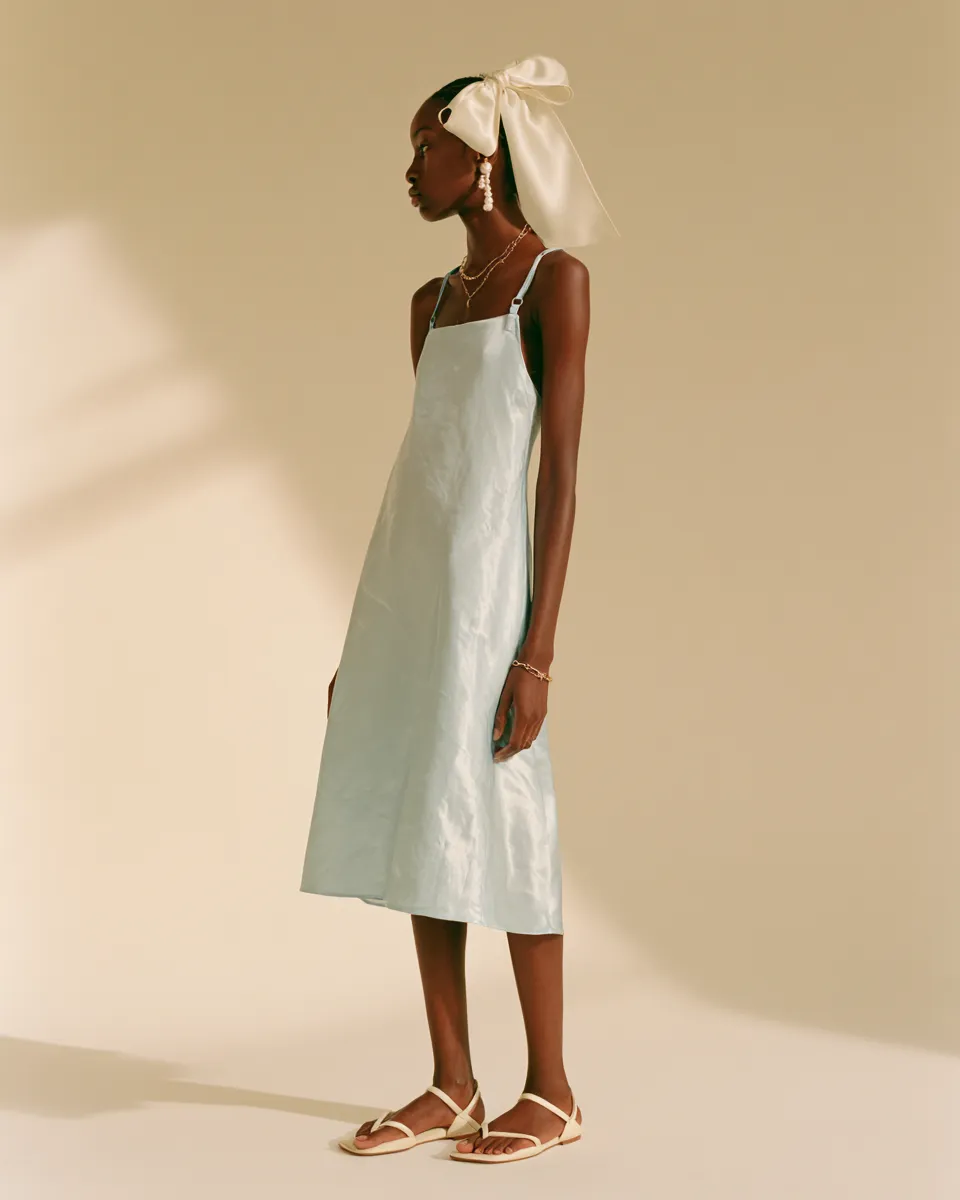 coquette aesthetic outfits baby blue satin slip midi dress pearl drop earrings ivory bow