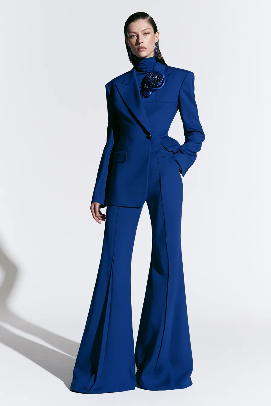 statement blue fashion look with sculptural pin accessories and wide-leg trousers