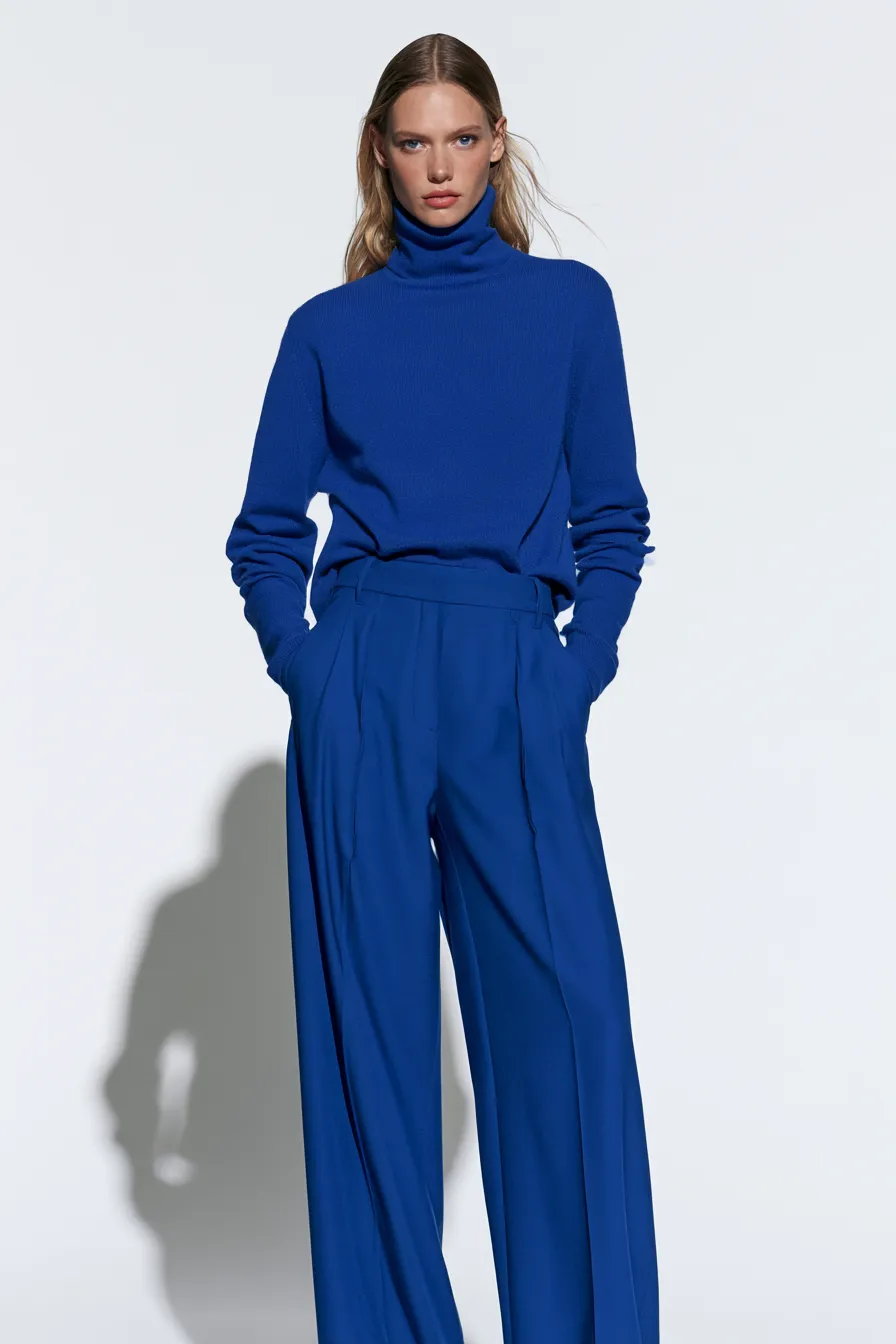 electric blue turtleneck outfit with cobalt trousers as a fashionable blue look
