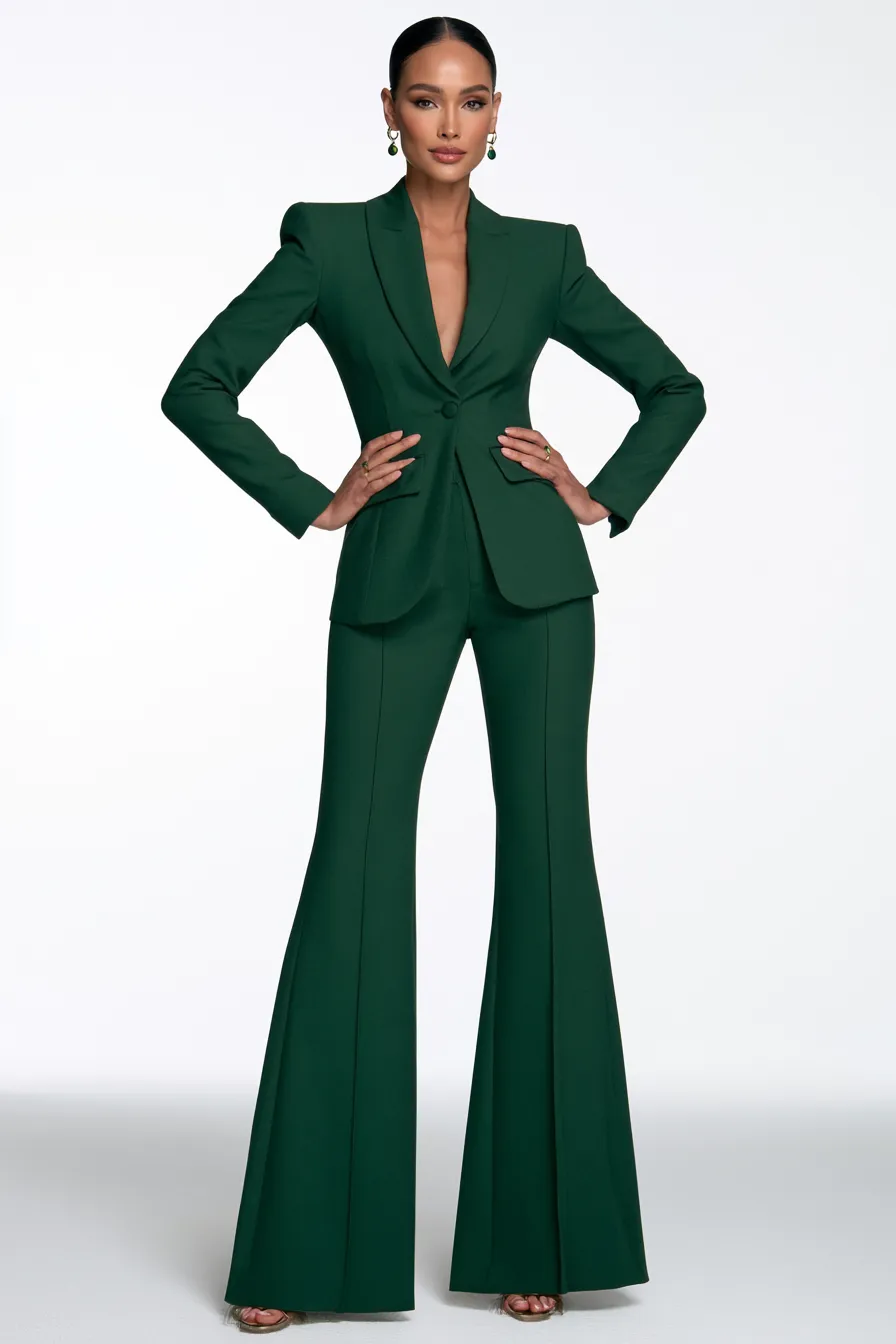 Standing model in fashionable green blazer and trousers in studio catalog shoot