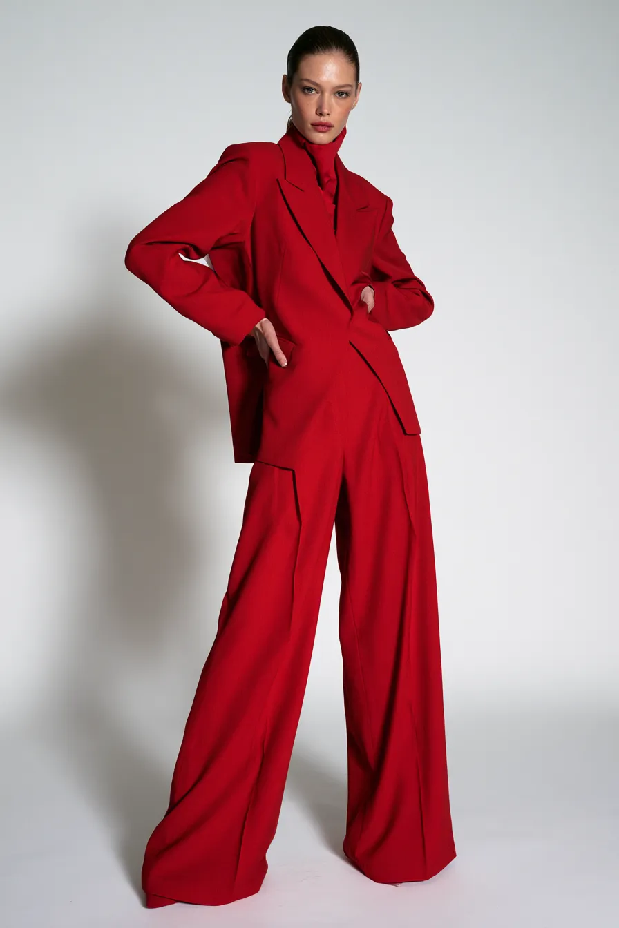 fashionable red monochromatic outfit in bold all-red editorial studio look