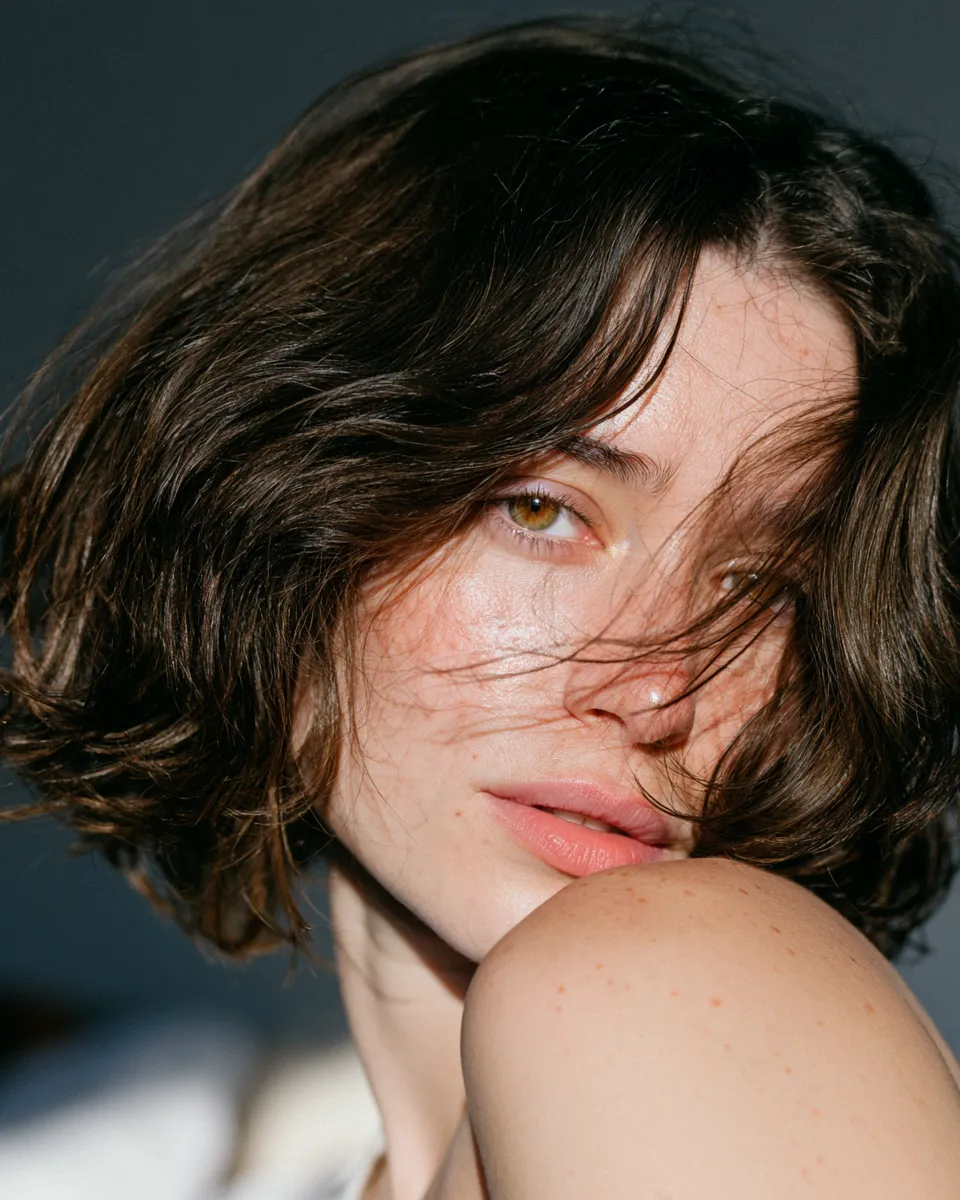 Woman with wavy short bob showing waves that last overnight without heat