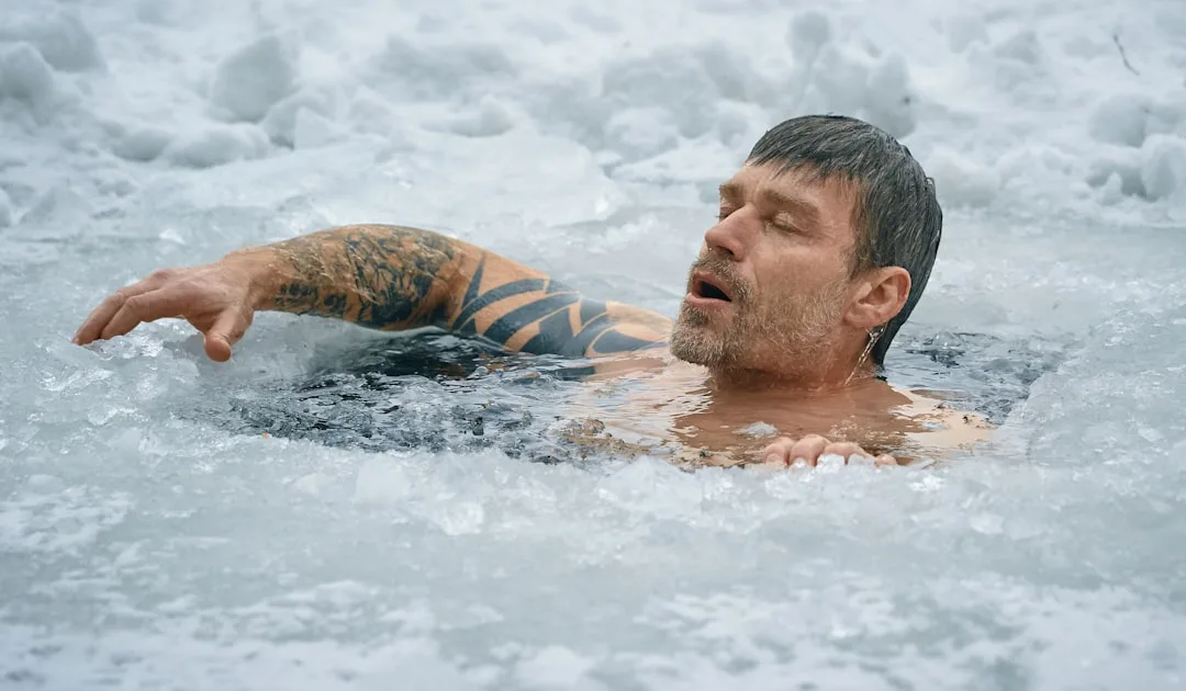 Athlete submerged in cold water immersion recovery therapy pool