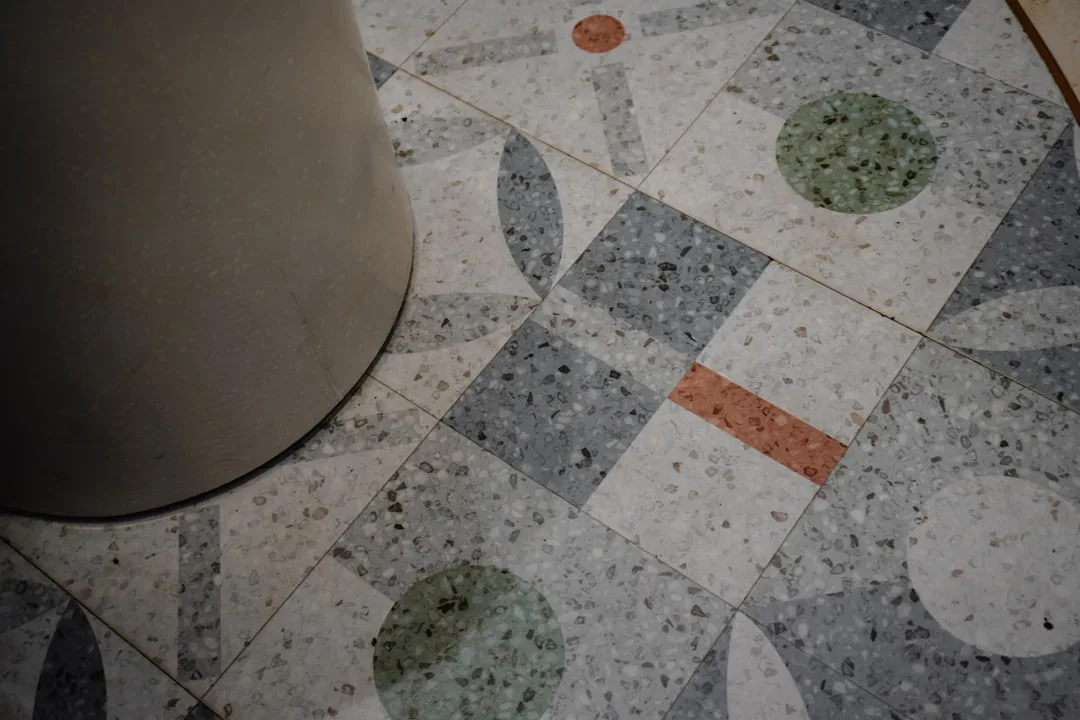 Close-up of terrazzo feature wall with white marble chips and gray cement matrix