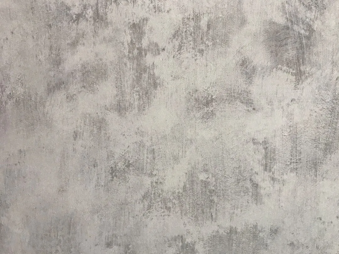 Layered monochromatic neutral wall finishes with matte and satin texture variation