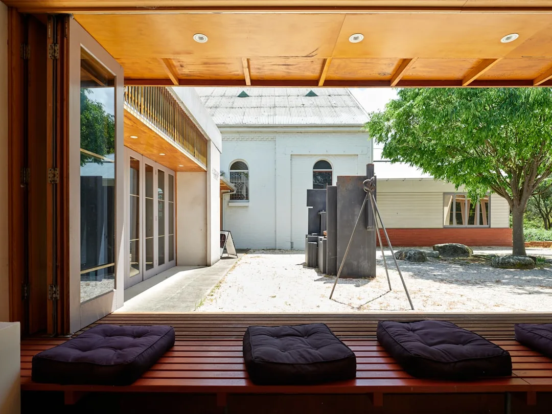 Heated outdoor patio flooring system installed beneath composite decking boards