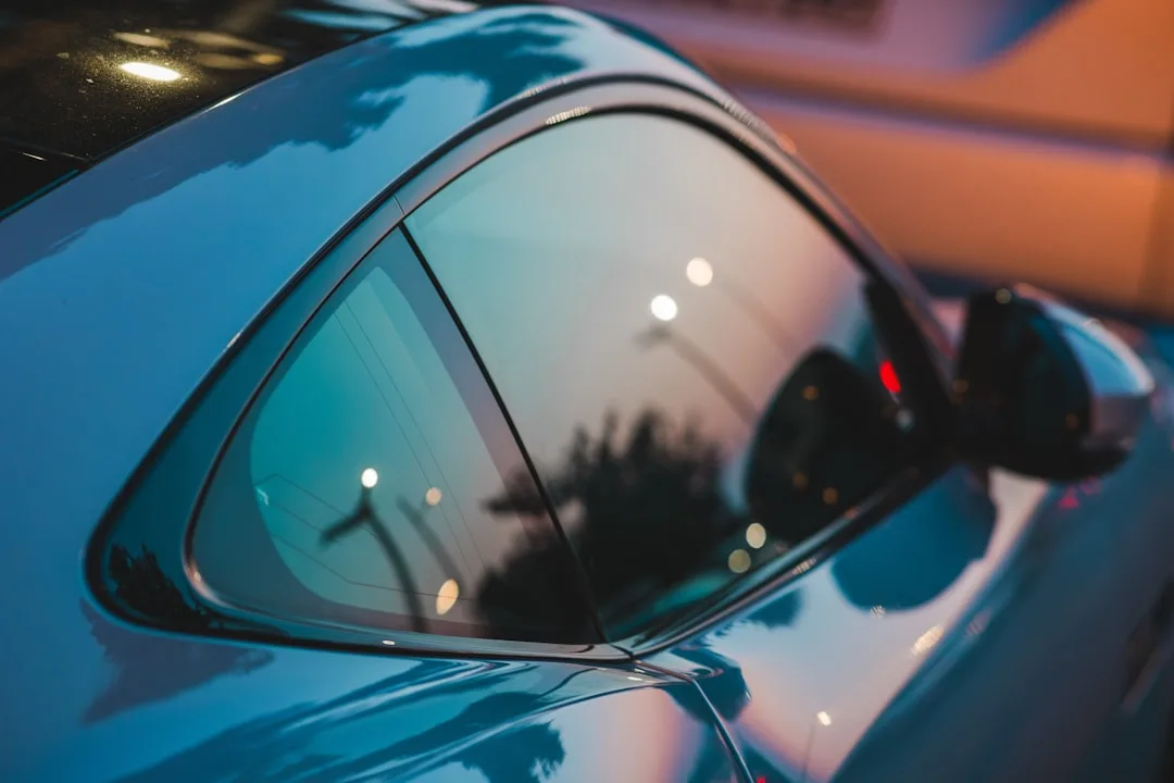 Close-up of ceramic window tint film on vehicle windows with UV protection indicators