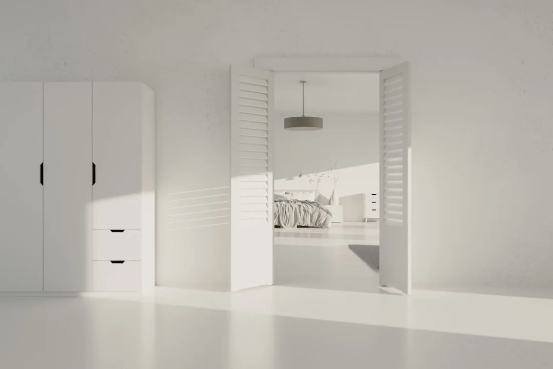 Minimalist entryway with built-in shoe storage and neutral palette