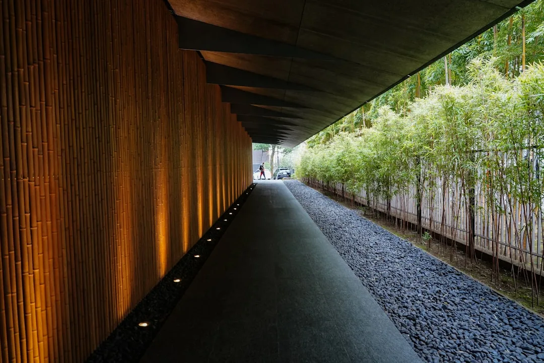 Warm-toned recessed lighting embedded in stone pathway at dusk