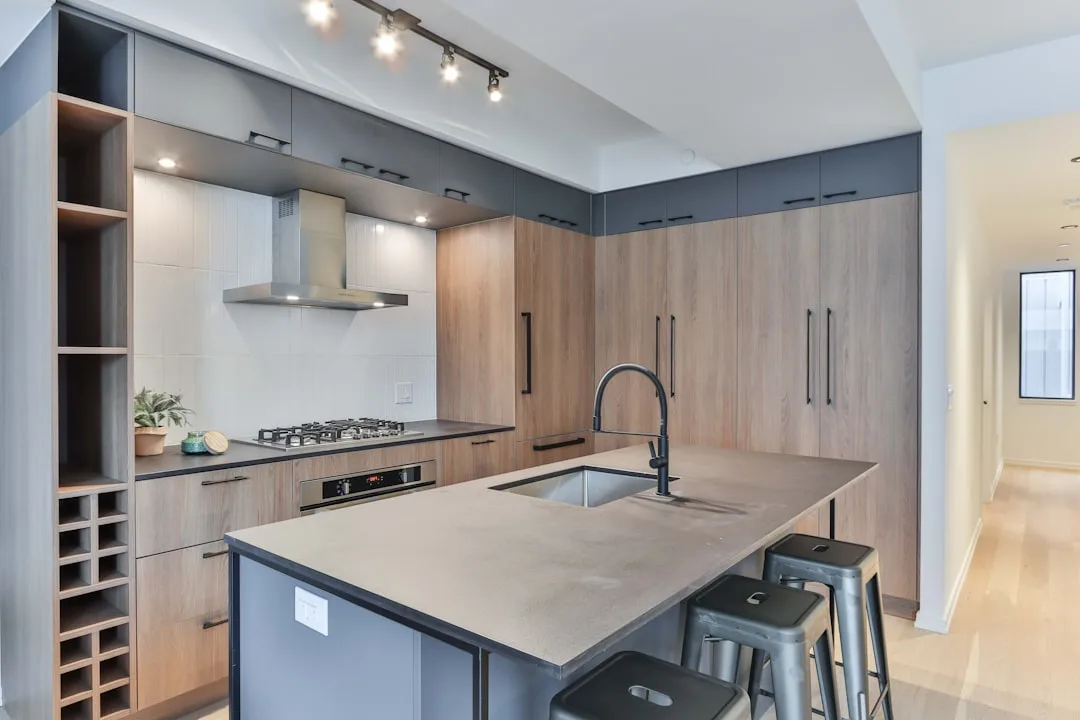 Modern kitchen island showing 15-inch seating overhang with proper leg room clearance