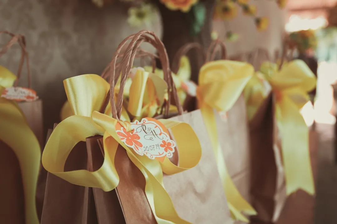 Wedding welcome bags arranged by guest preference showing vegan snacks, coffee, and wellness items