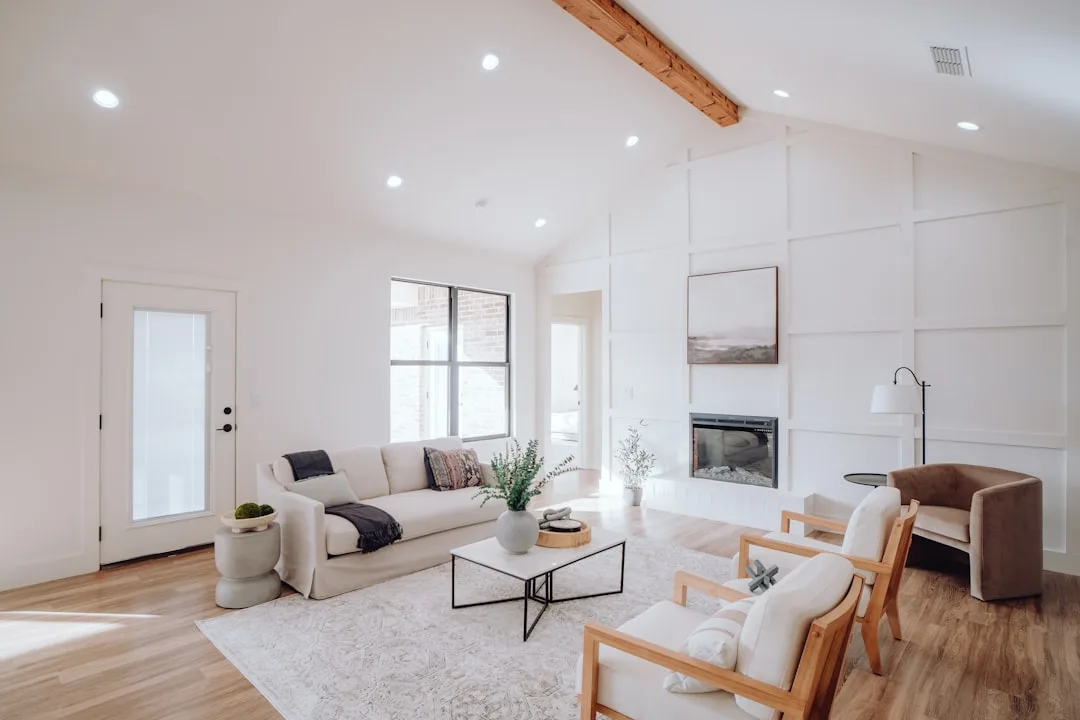 Modern living room ceiling design with exposed wood beams and geometric detail