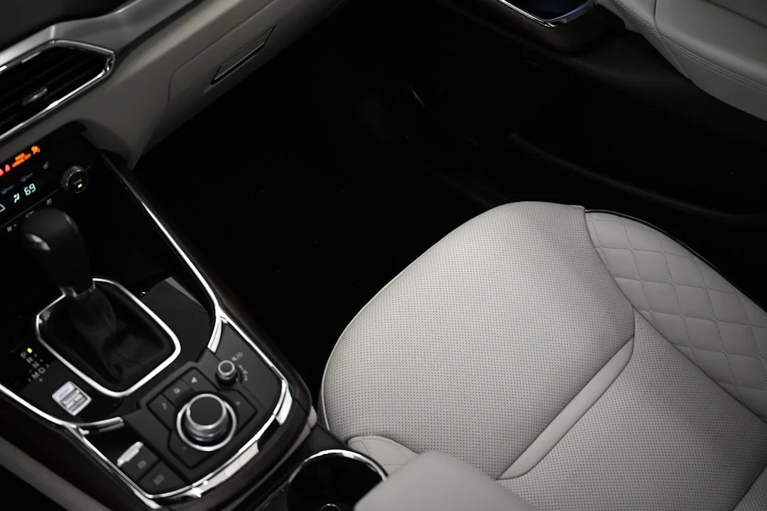 close-up of heated seat button controls in luxury sedan dashboard