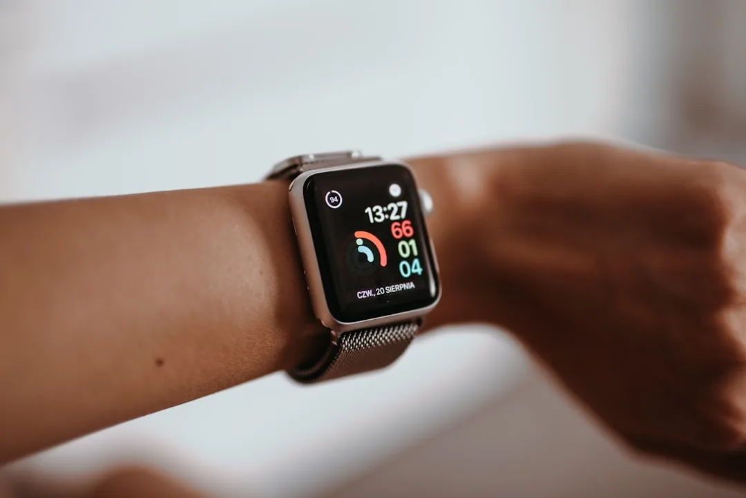 person wearing health monitoring wearable smartwatch device — Tech & Future perspective 2