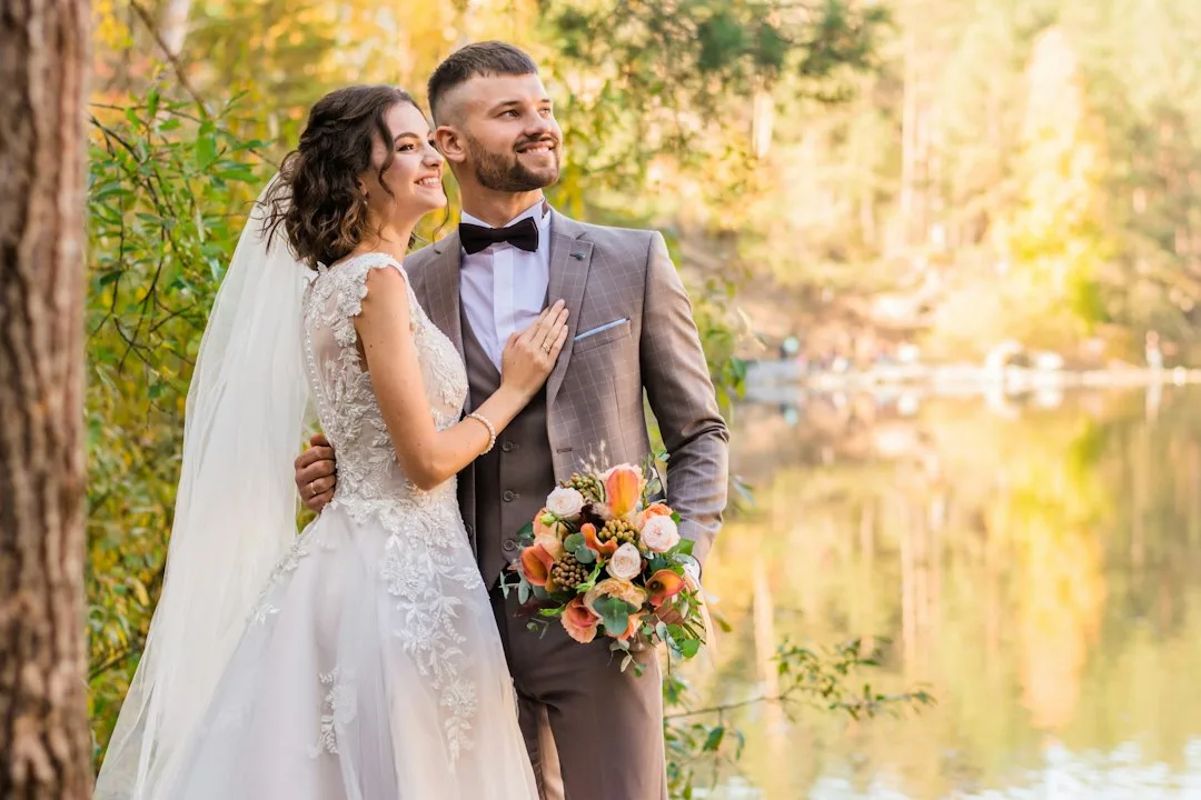 bride and groom reviewing detailed wedding day timeline with planner