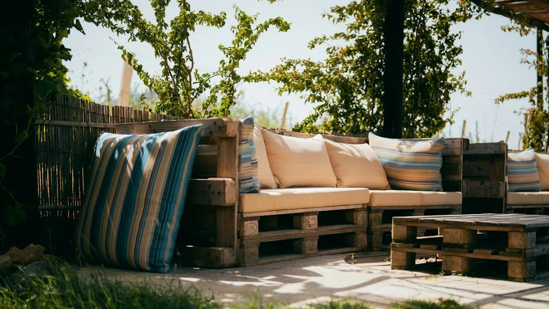 Modern outdoor patio corner zone with integrated seating and plants