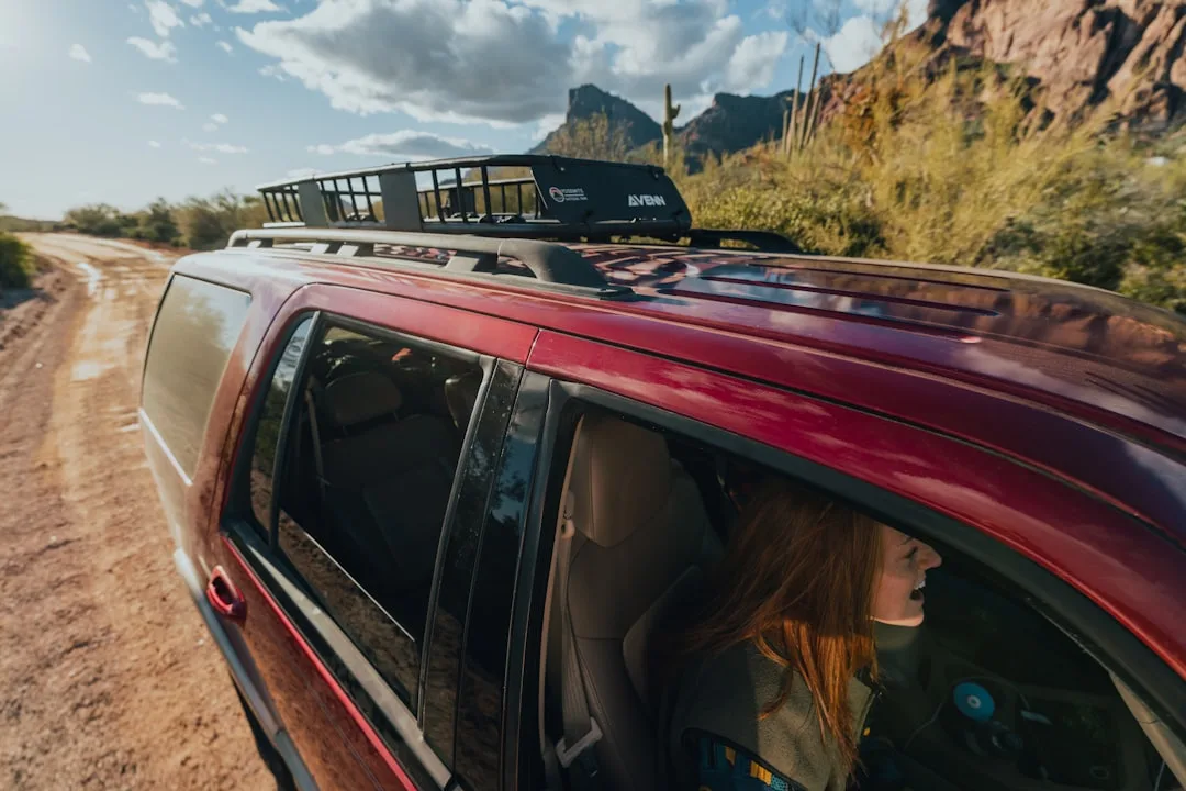 Close-up of vehicle roof-mounted cargo box with weatherproof locking mechanism