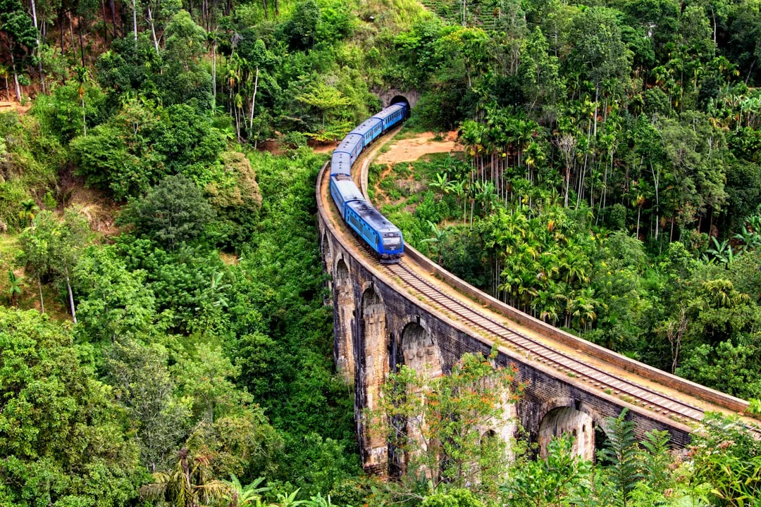 Passengers boarding modern train using regional rail pass in Thailand