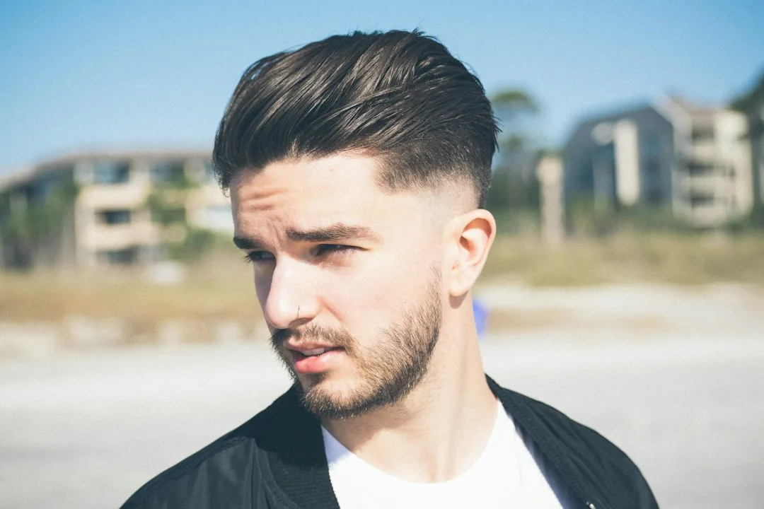 Modern textured undercut showing precision fade and layered texture on top