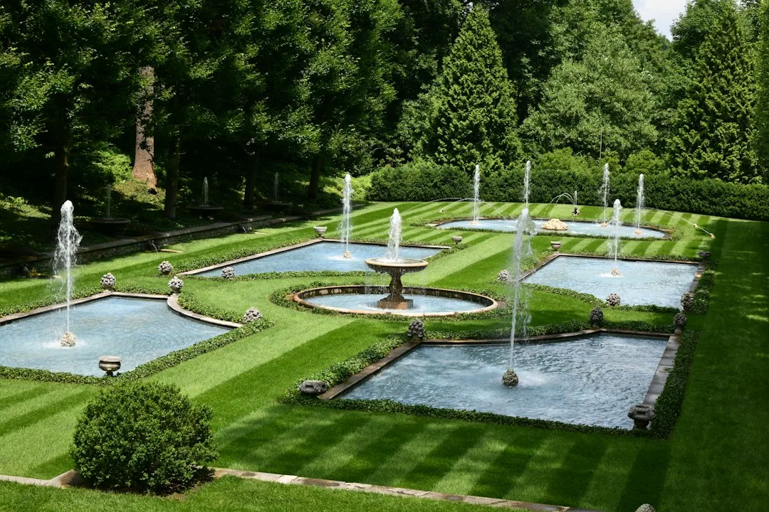 Contemporary tiered fountain water feature in minimalist garden design