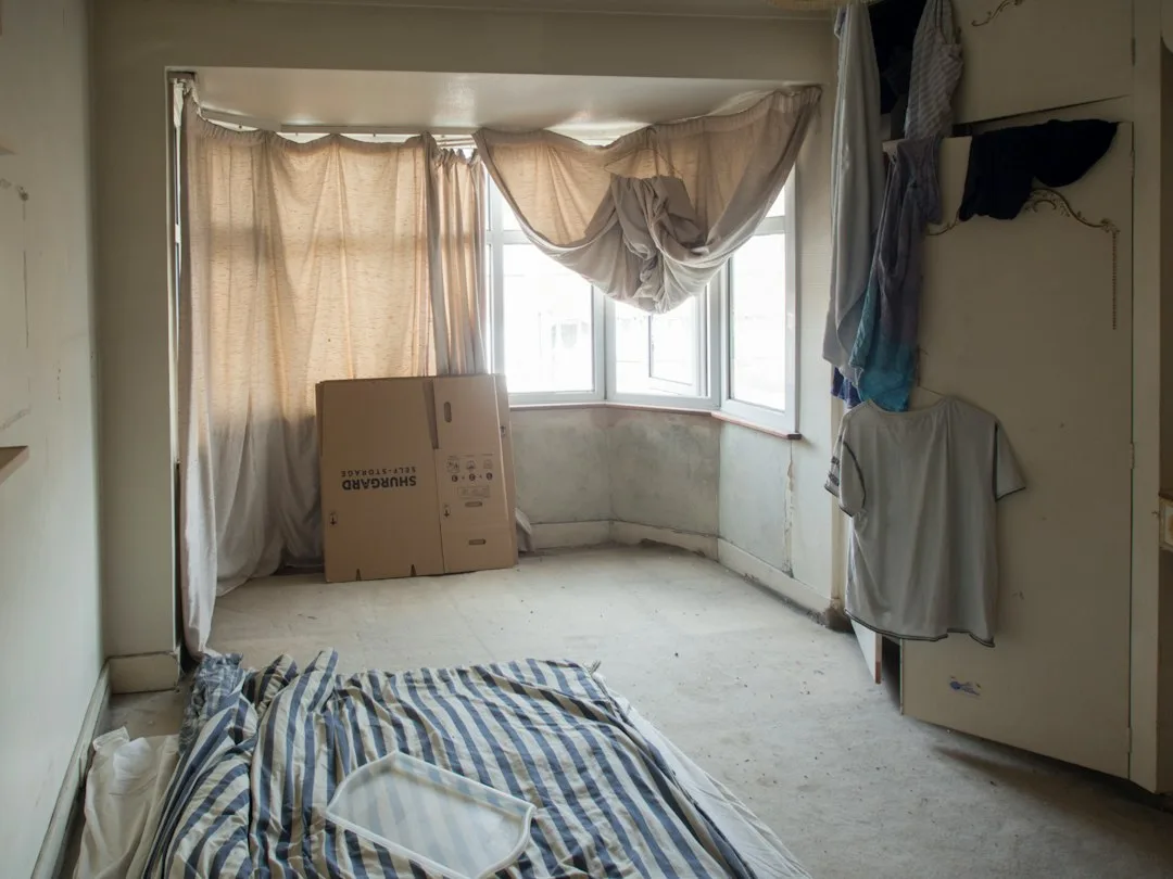 Unfurnished studio rental with white walls and hardwood subfloor