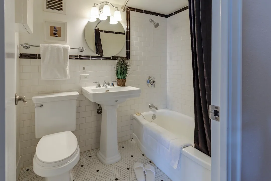 Bathroom tile grout being sealed with professional-grade penetrating sealer