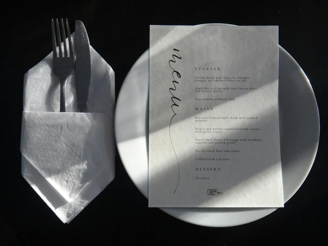 Custom wedding menu card with guest names and personalized dining details