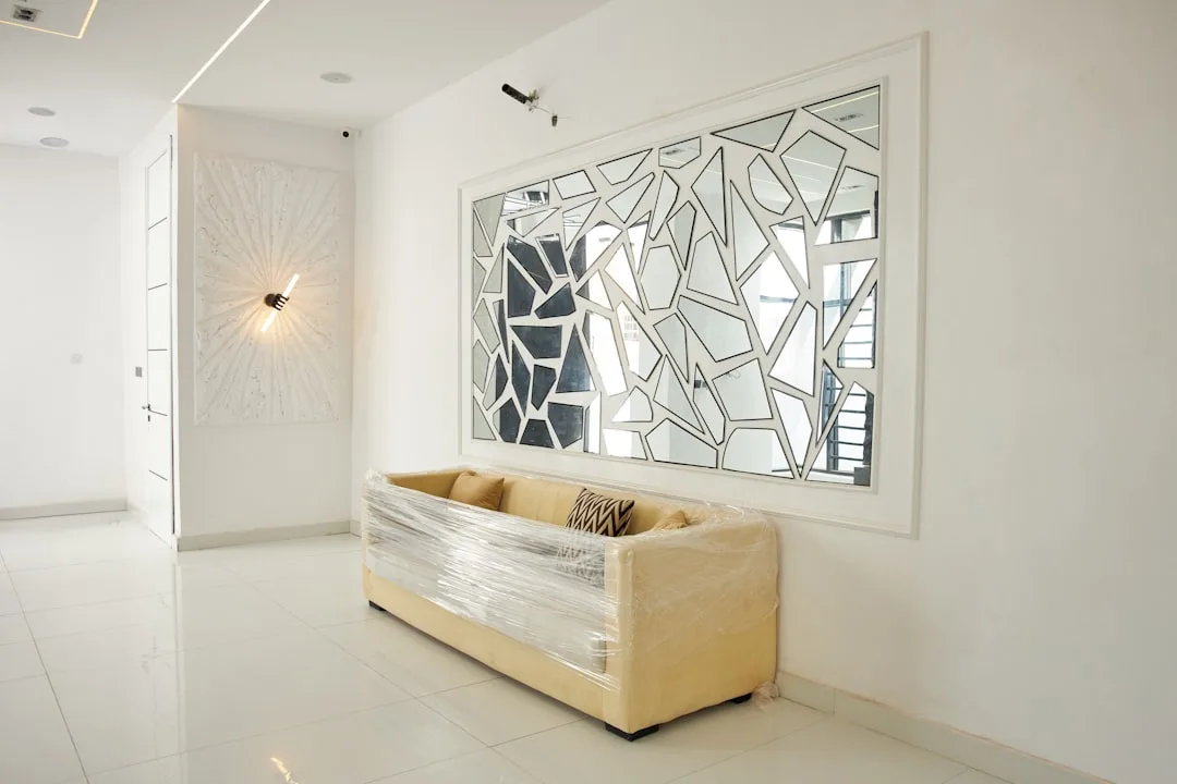 Sleek metal-framed modular divider creating separate zones in loft