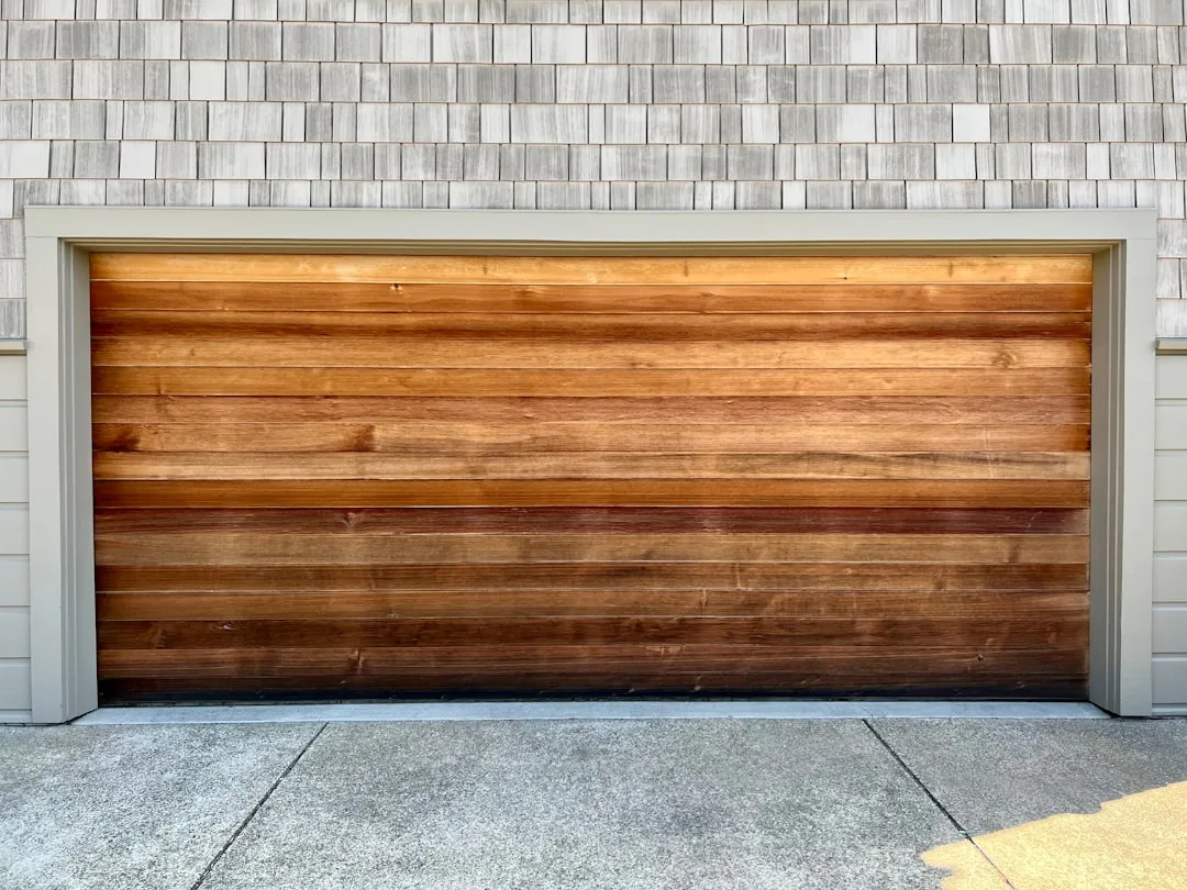 Close-up of rubberized foam weatherstrip seal around garage door frame