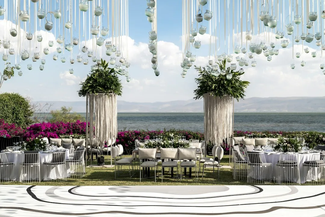 Fabric draping and structural frame wedding ceremony backdrop installation