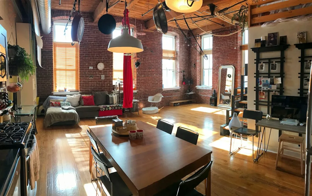 Historic mill building exterior transformed into residential adaptive reuse development