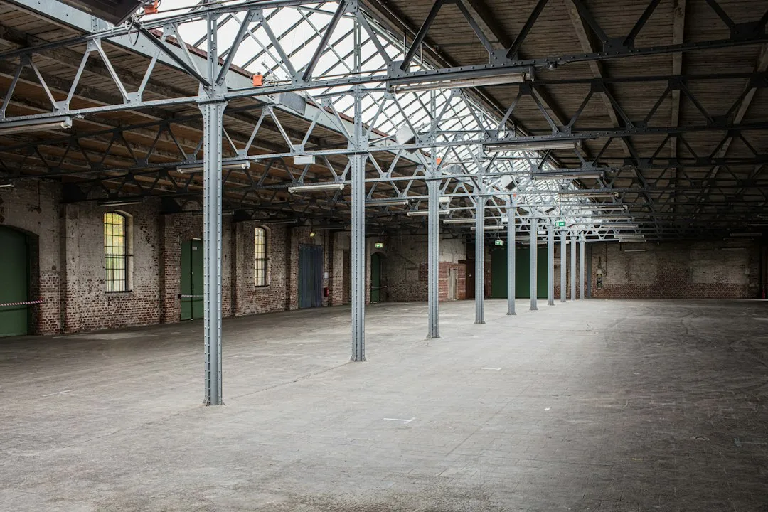 Exposed brick wall and steel beams in converted adaptive reuse warehouse loft apartment