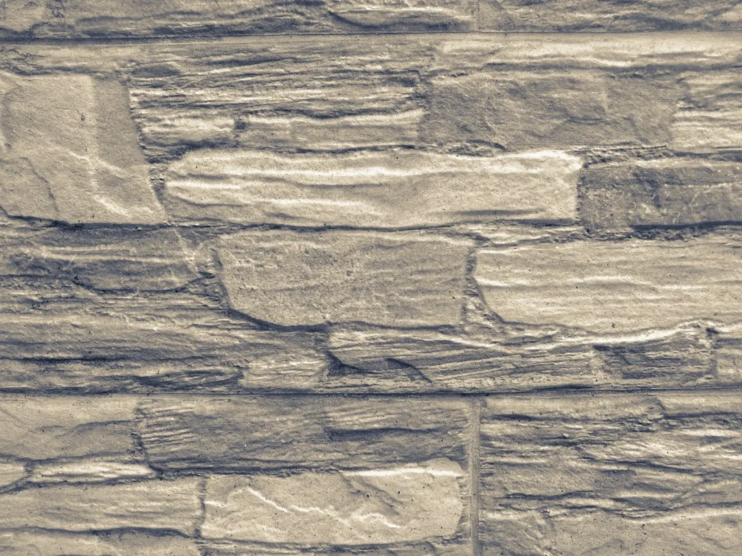 Curved fireplace surround with natural stone and integrated shelving storage
