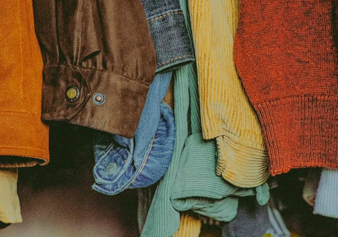 Close-up of satin maxi skirt layered with chunky knit sweater
