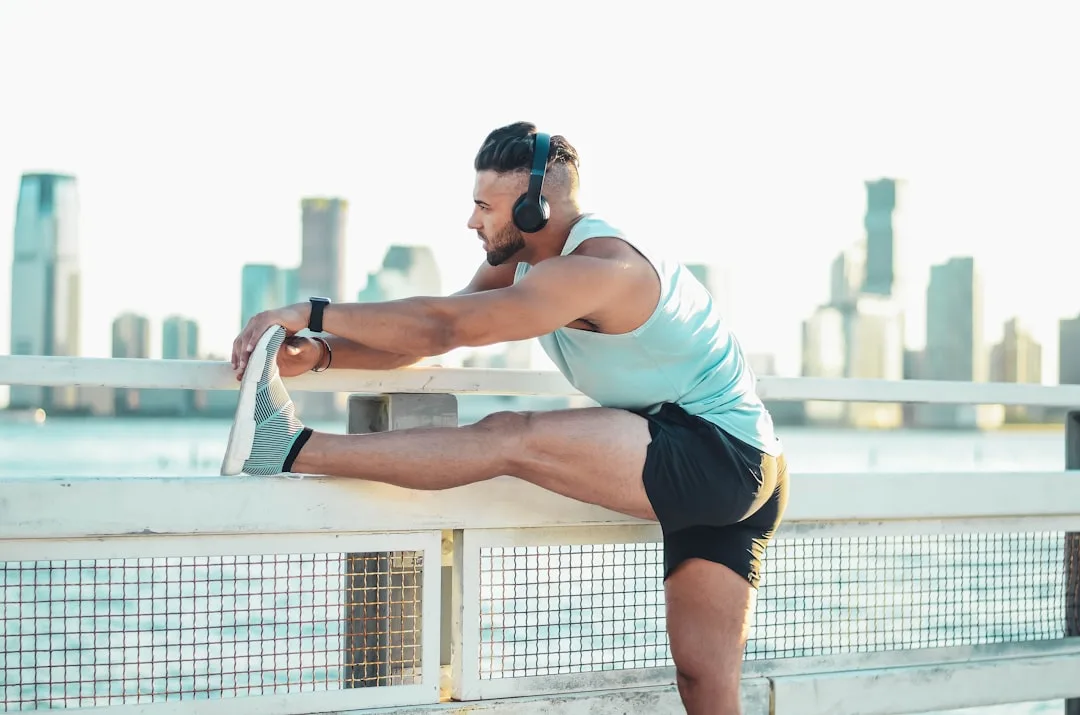 Athlete performing easy-paced recovery cardio walk and stretch