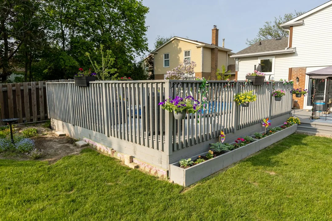 Dense bamboo and laurel hedge sound barrier blocking street noise from residential patio