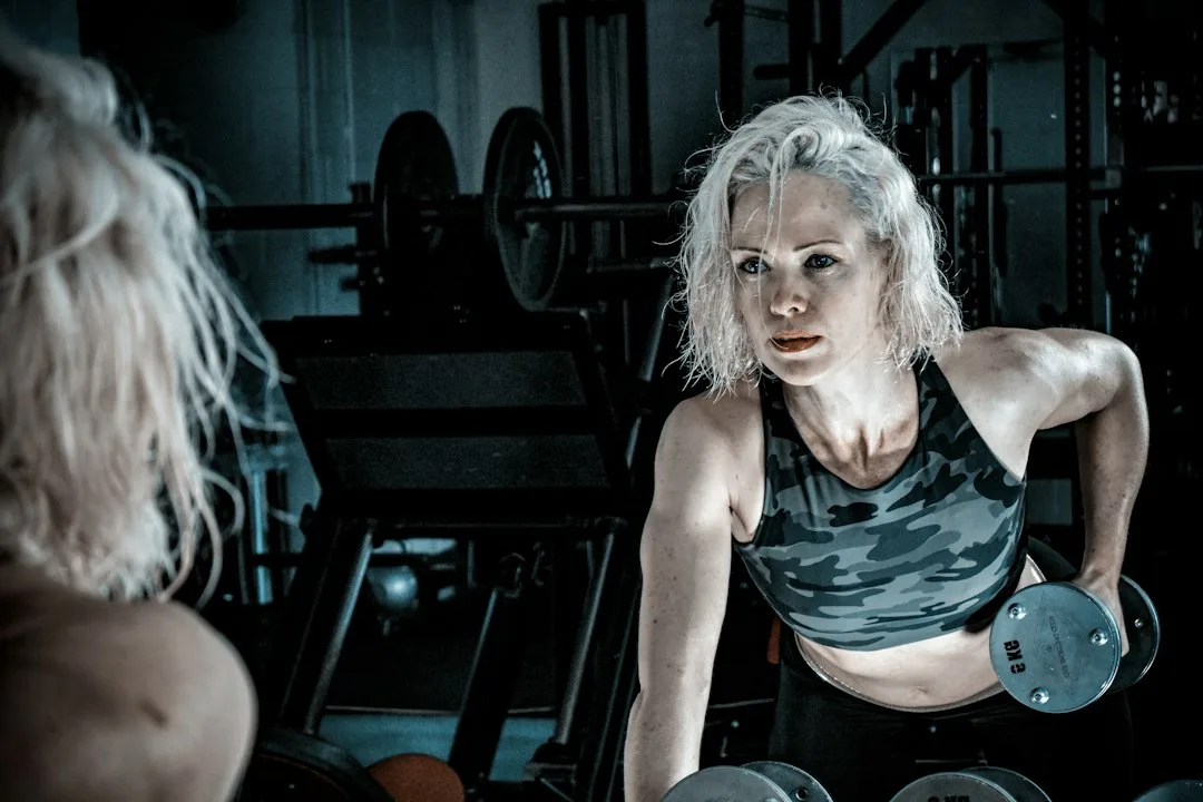 Woman using suspension trainer for low-impact compound movement pattern