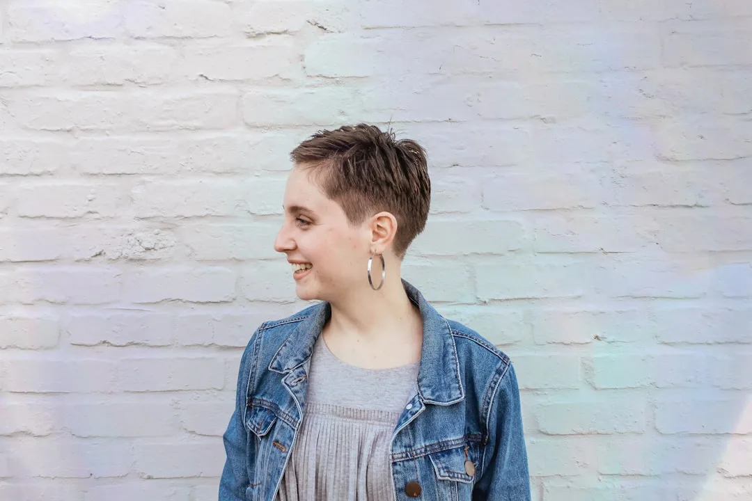 Close-up of textured pixie bob hybrid with feathered layers and dimensional styling