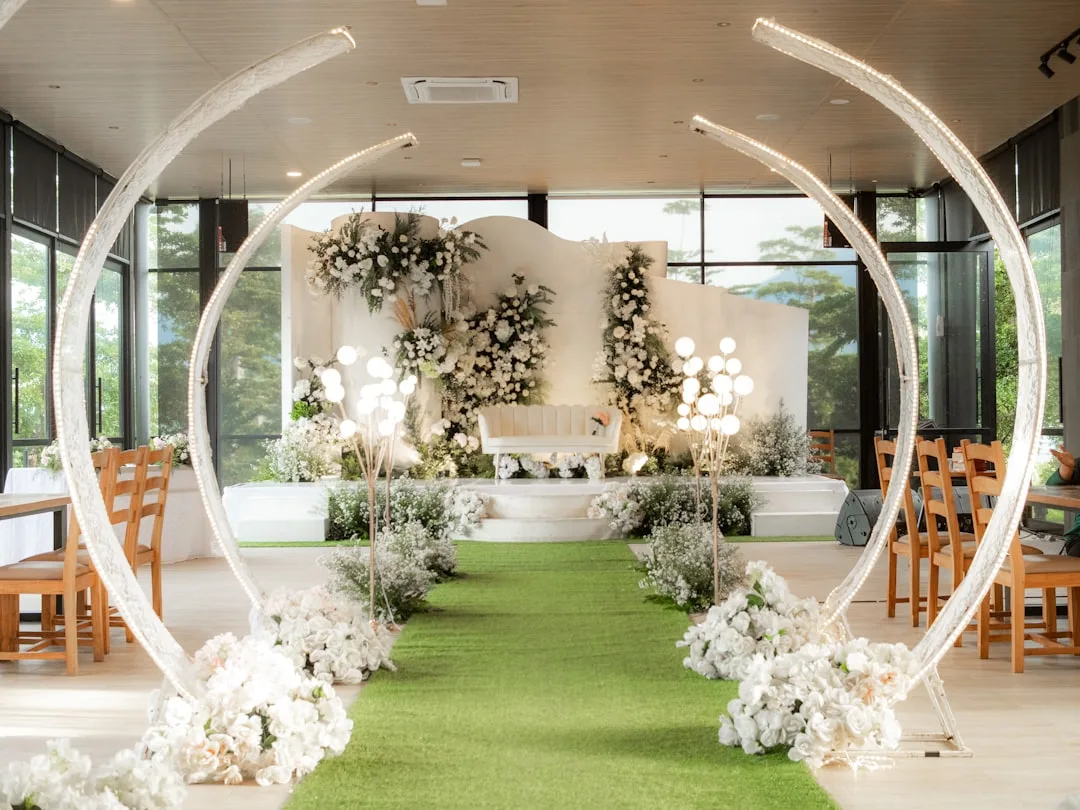 Modern wedding ceremony backdrop with layered geometric frames and warm lighting