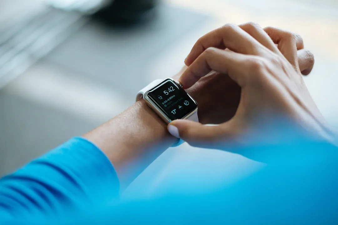 person wearing health monitoring wearable smartwatch device — Tech & Future perspective 1